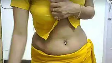Tamilxxxxvidoes - Yellow saree desi babe nude strip and dance on cam indian sex video