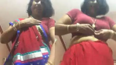 Sexsari - Desi female in a red sex sari flashes her xxx jugs changing the clothes  indian sex video