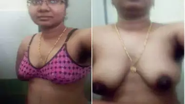 Attractive Indian woman with glasses shows XXX assets in bathroom