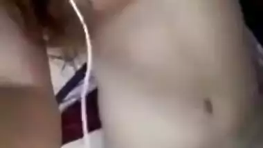 Young Indian chick perfectly combines listening to music with masturbation
