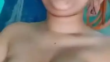 Desi aunty showing her boobs and fingering in bathroom