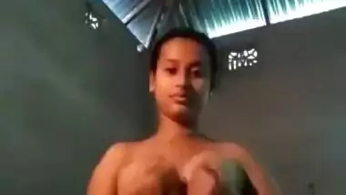 Slim village girl spreading pussy lips showing
