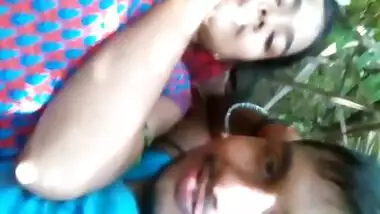 Loving Indian couple kisses lying on grass before porn action