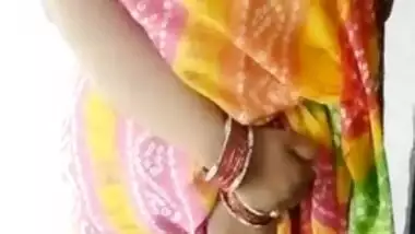 Woman in a colored dress teases Desi guys revealing big breast