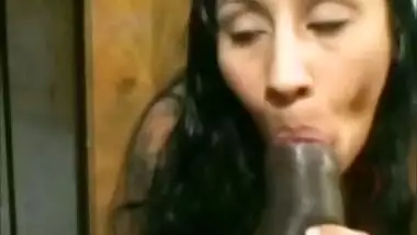 Indian wife passionately sucking African cock