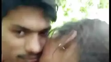 Lovers Smooching in Forest