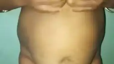 Fat Indian woman motivates hubby to have sex by showing giant XXX tits