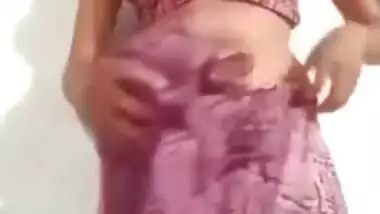 Pleasant Desi girl takes off pink dress in her first porn video