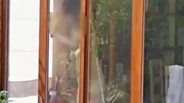 Neighbour cleaning windows.