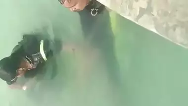 Giving handjob in swimming pool