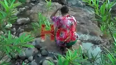 Young girl bathing in jungle showing hot bareback and cleavage