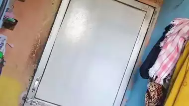 Perverted neighbor records a desi milf bathing in her bathroom