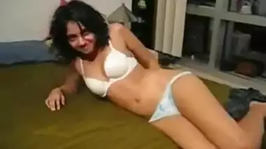 cute indian stripping in bed