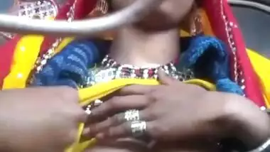 Desi chick pulls her bright dress up to demonstrate big XXX boobs