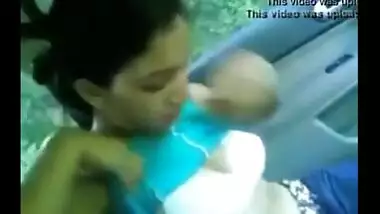 Young couple have some romantic outdoor fun in their car