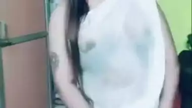 Desi girl in transparent sari dances and sings in short TikTok video