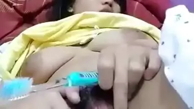 Masturbating by toothbrush