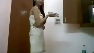 Cute and sexy Pakistani girl smoking wearing a towel