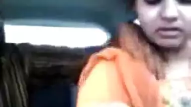 Tamil guy smooching and pressing boobs of cute girl in car