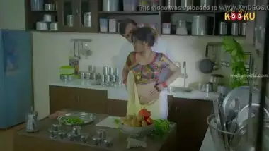 Indian girl by old man in kitchen