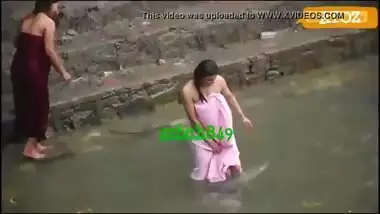 Indian village girls having a public bath