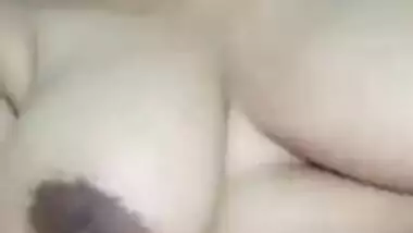 Indian XXX slut demonstrates her sex sized breasts and licks nipples