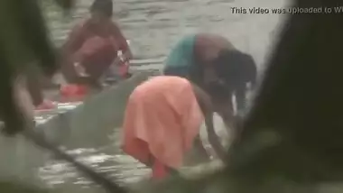 Tamil women bathing by the river