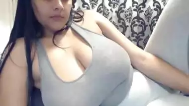 Busty Indian teen shaking massive tits in webcam