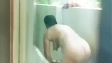 A chubby Desi aunty bathing outdoor nude on cam for her lover XXX video