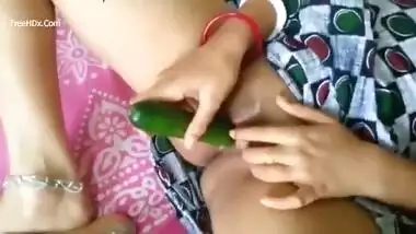 Horny Desi gal brave enough to shove cucumber into bald XXX snatch