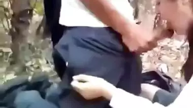 Desi school girl blowjob in the middle of the jungle