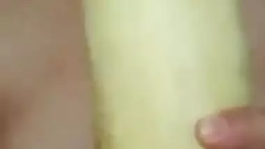 Horny girl sucking cucumber