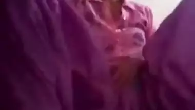 Pretty Desi girl in purple outfit plays with pussy fantasizing about porn