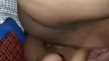 Indian woman touches her pink vagina with two hands in close-up porn