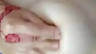 Desi female with tattooed hands receives pleasure touching chest