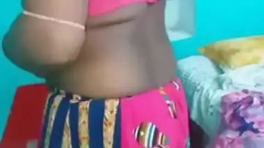 Hot like hell Desi female in sexy pink dress poses for the camera