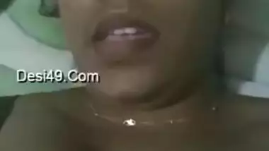 Indian aunty with sexy full lips takes big natural boobs out in bed