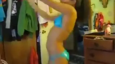 Indian babe in shiny aqua bikini