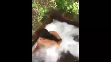 Teen in Indian Village take bath outdoor