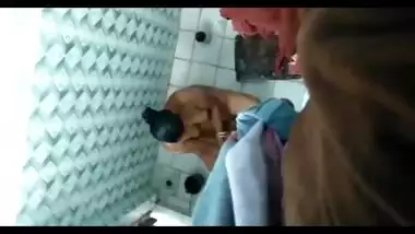 Voyeur finds a way to film Indian landlady washing wonderful body