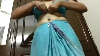Desi housewife takes off blue dress to brag about her porn treasures