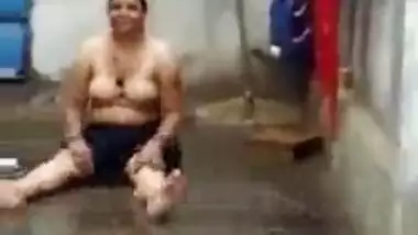 Topless matured aunty enjoying rain