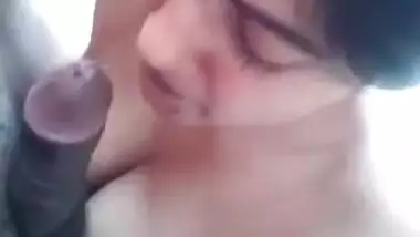 Desi Girl Happily Sucking Dick with Porn Playing in Background