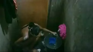Bangladeshi young girl taking shower.