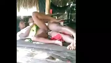 Young couple enjoy outdoor sex in a tent house on the beach