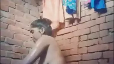 Attractive Desi village girl displays XXX assets while bathing nude